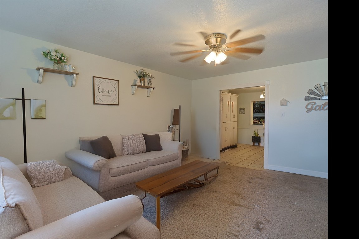 1403 Harris Hill Road San Marcos, TX 78666 - Photo 10 of 13 a living room with furniture and a ceiling fan