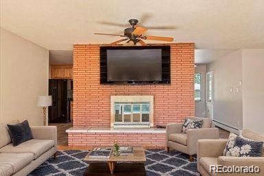 5 Rutgers Avenue Pueblo, CO 81005 - Photo 4 of 48 a living room with furniture and a flat screen tv