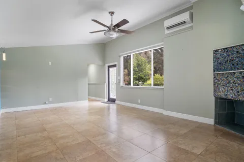 a kitchen with stainless steel appliances granite countertop a stove microwave and sink