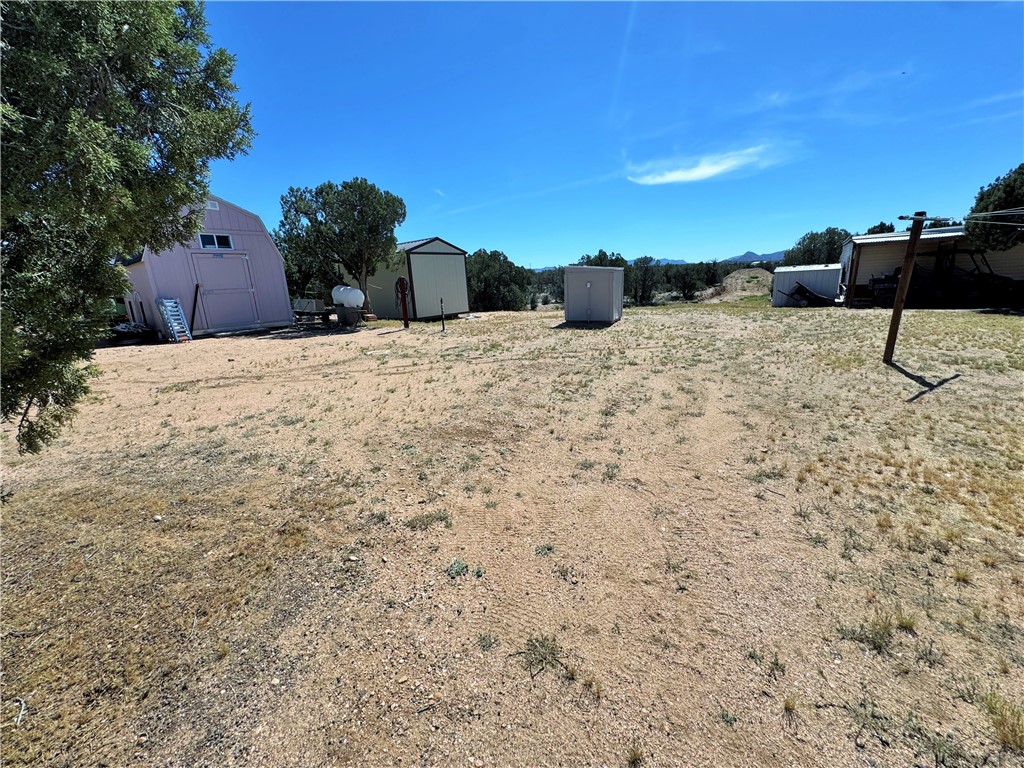 14224 East Randy Ranch Road Kingman, AZ 86401 - Photo 43 of 75 The property features a spacious, undeveloped lot with distant mountain views, offering ample space and potential