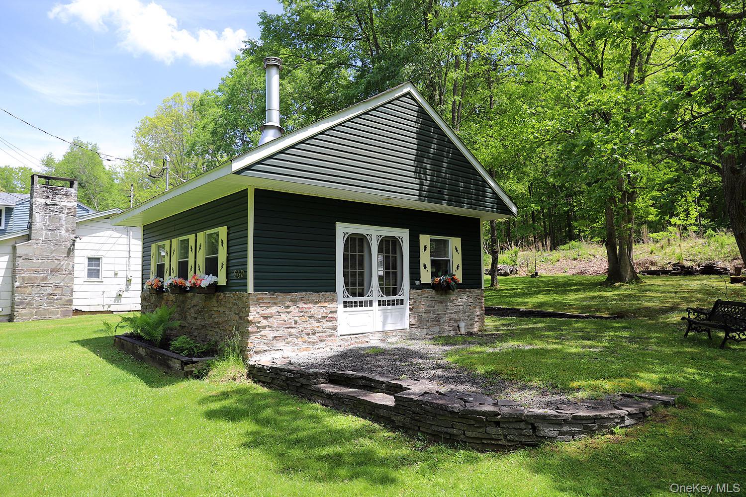 860 River Road Callicoon, NY 12723 - Photo 35 of 45 a front view of a house with a yard