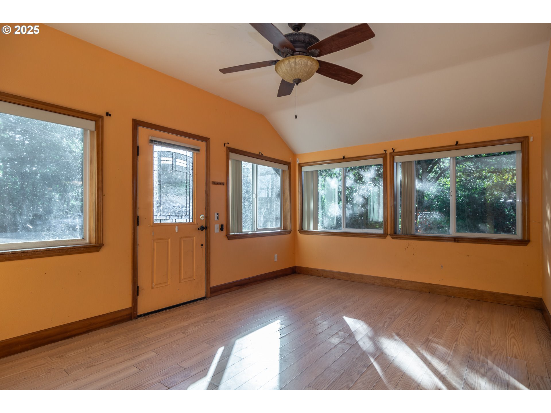 839 Union Gap Loop Oakland, OR 97462 - Photo 2 of 24 a view of an empty room with a window and wooden floor