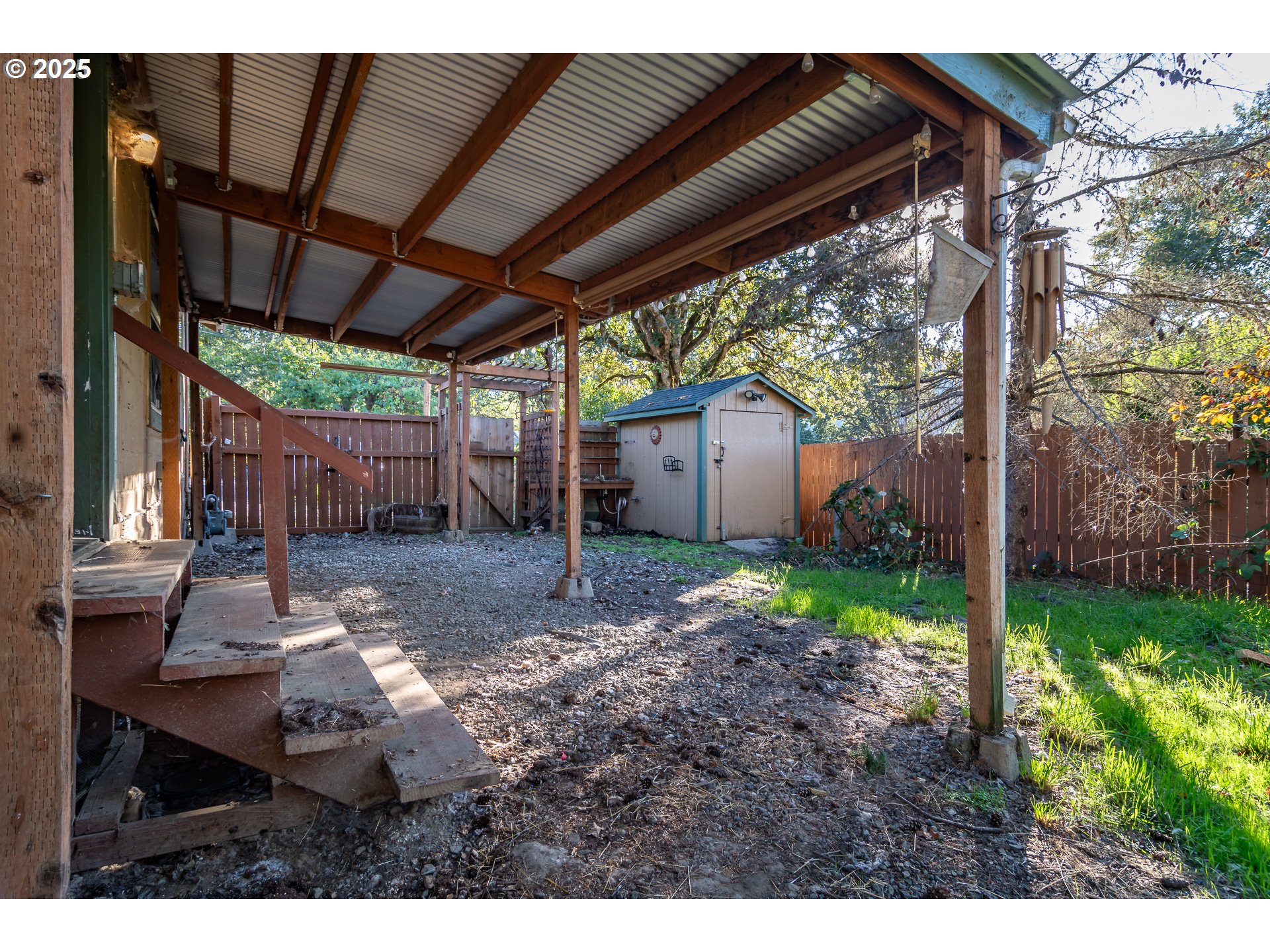 839 Union Gap Loop Oakland, OR 97462 - Photo 24 of 24 a backyard of a house with table and chairs