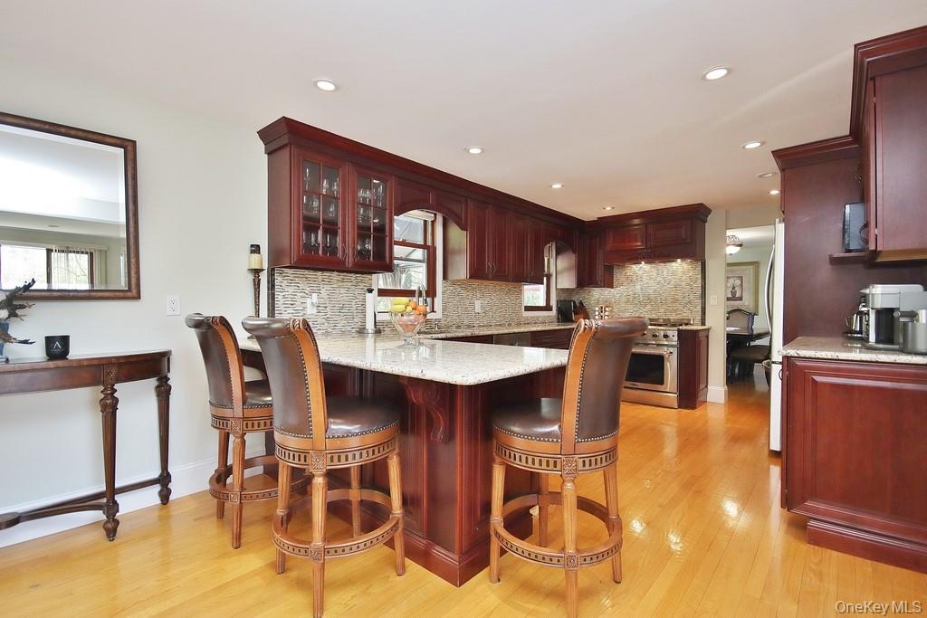 30 Granite Springs Road Granite Springs, NY 10527 - Photo 6 of 37 a dining hall with stainless steel appliances kitchen island granite countertop a table and chairs
