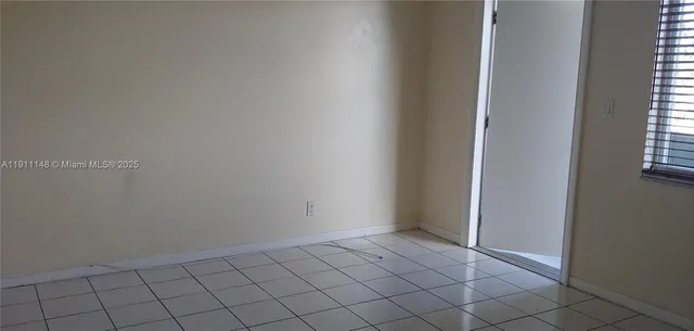 a view of a hallway with a white walls