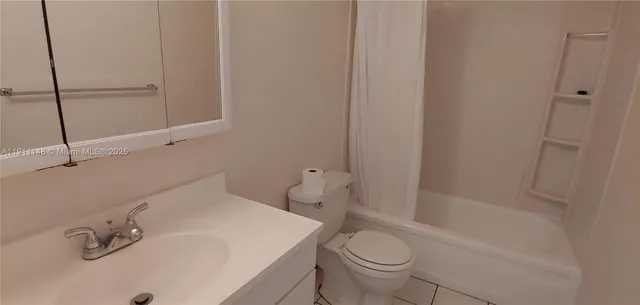 a bathroom with a shower and a toilet
