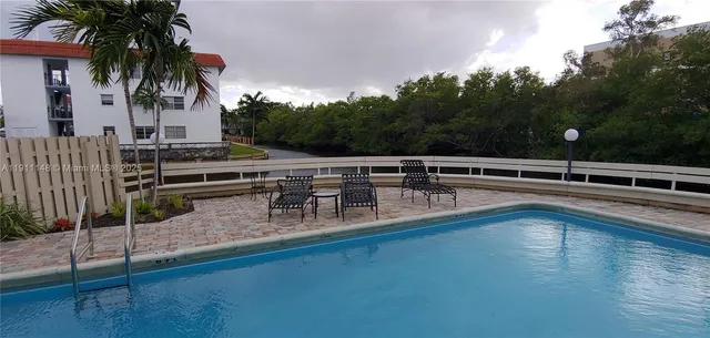 a view of a lake with a house in the background