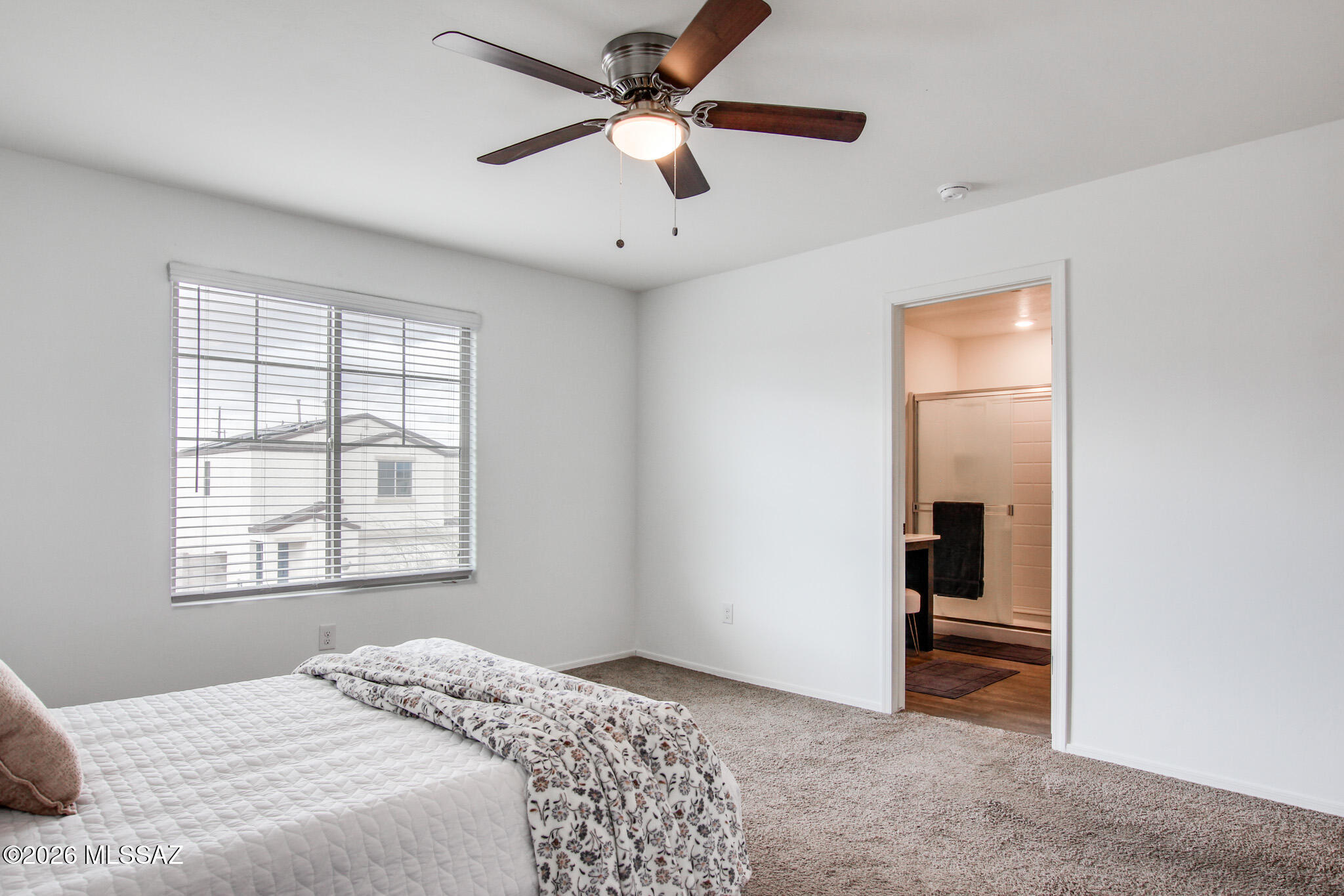 5987 South Antrim Loop Tucson, AZ 85706 - Photo 22 of 34 a bedroom with a bed and a window