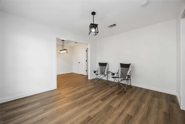 a view of a livingroom with wooden floor