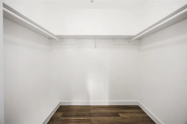 a view of room with wooden floor