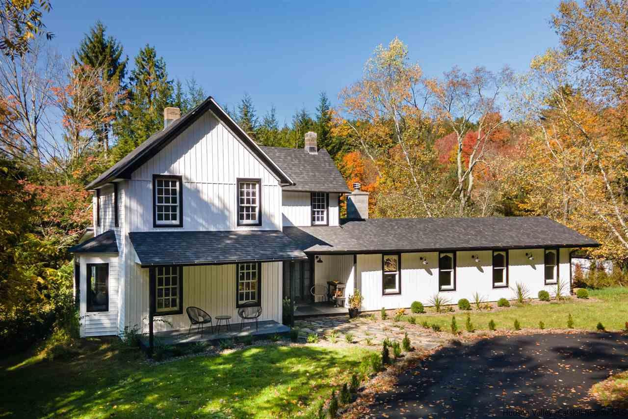 9 Clark A Road Woodbourne, NY 12788 - Photo 1 of 35 a front view of a house with a yard table and chairs
