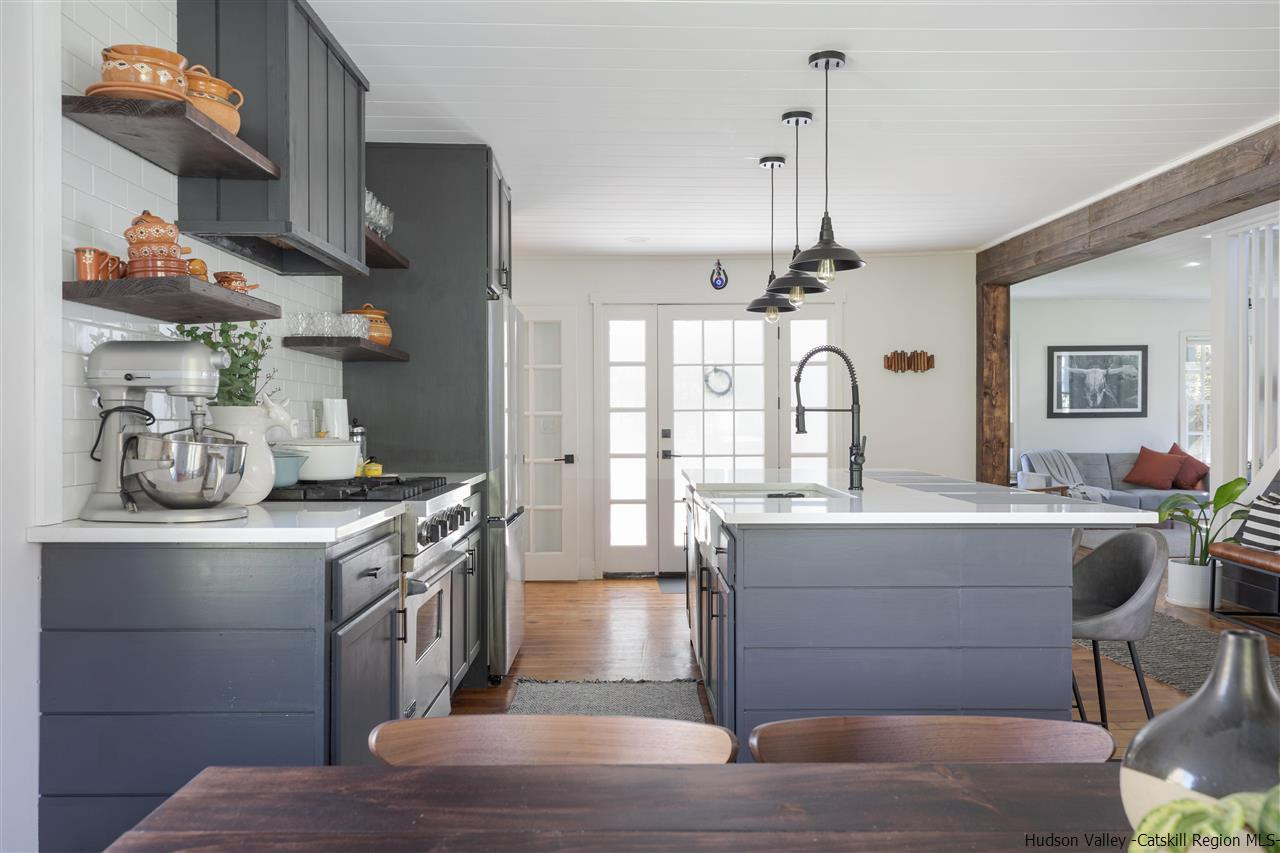 9 Clark A Road Woodbourne, NY 12788 - Photo 12 of 35 a kitchen with kitchen island granite countertop a stove and a sink