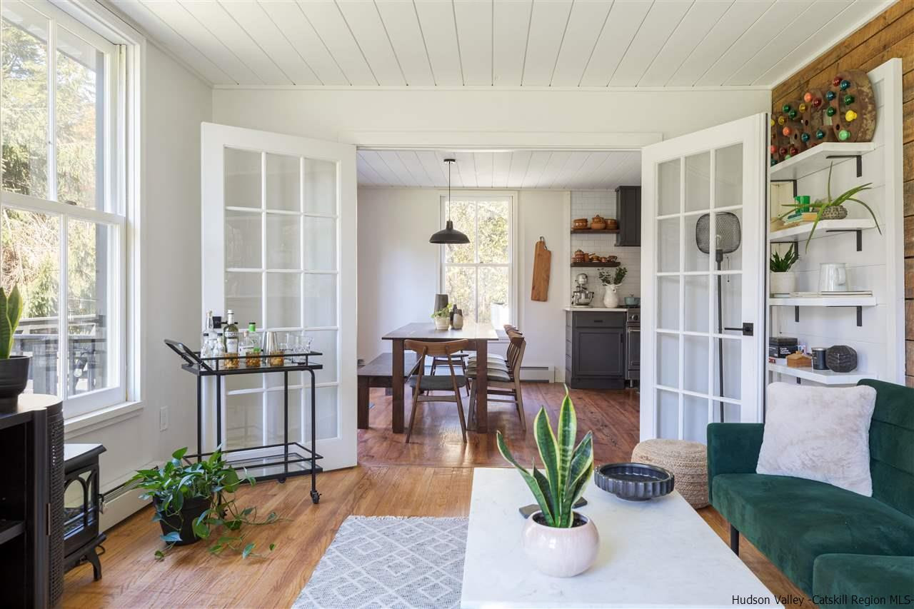9 Clark A Road Woodbourne, NY 12788 - Photo 14 of 35 a living room with furniture a potted plant and a large window