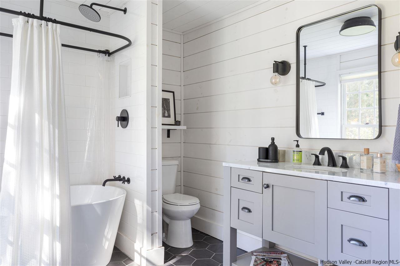 9 Clark A Road Woodbourne, NY 12788 - Photo 18 of 35 a bathroom with a toilet sink and shower