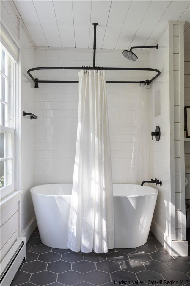 9 Clark A Road Woodbourne, NY 12788 - Photo 19 of 35 a white tub sitting next to a window