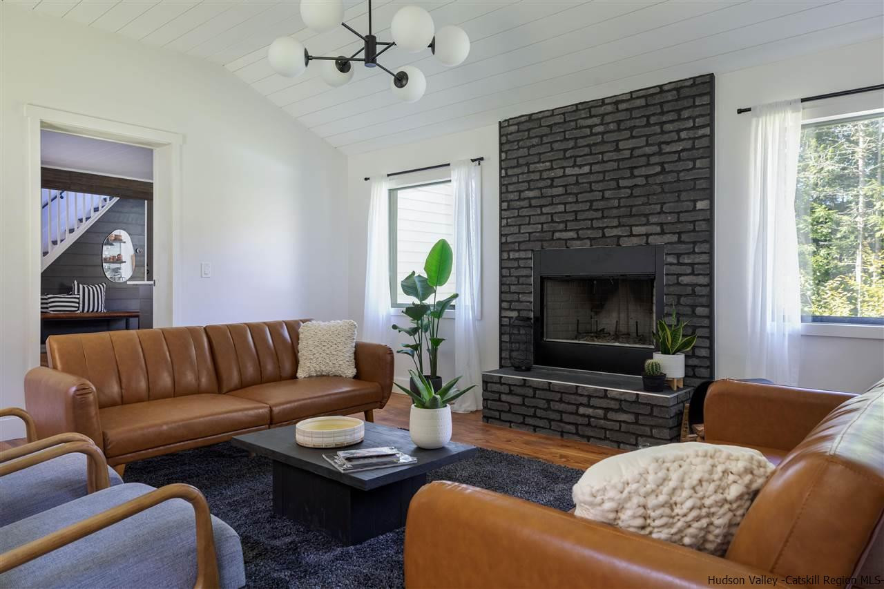 9 Clark A Road Woodbourne, NY 12788 - Photo 20 of 35 a living room with furniture and a fireplace