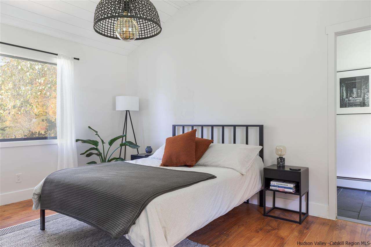 9 Clark A Road Woodbourne, NY 12788 - Photo 21 of 35 a bedroom with a bed lamps and a window