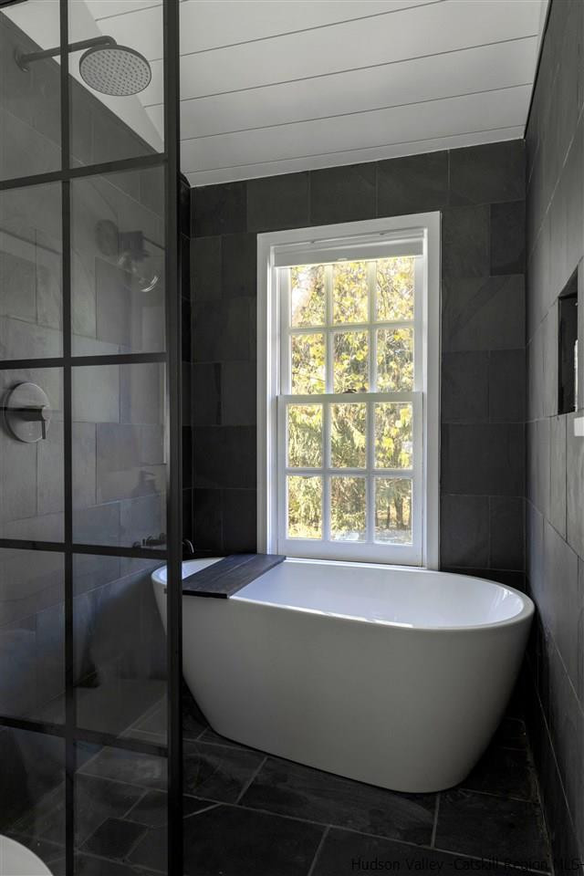 9 Clark A Road Woodbourne, NY 12788 - Photo 22 of 35 a bathroom with a bathtub and a shower