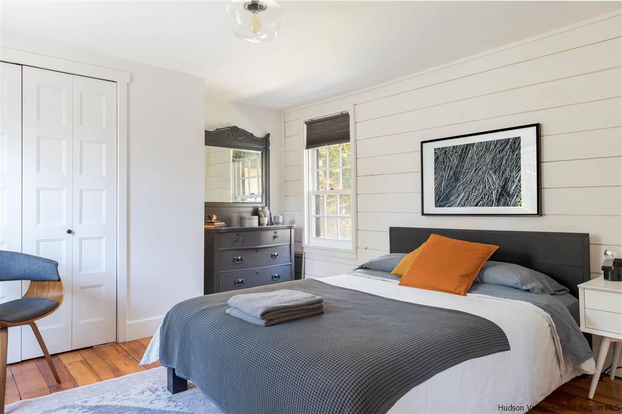 9 Clark A Road Woodbourne, NY 12788 - Photo 25 of 35 a bedroom with a bed and wooden floor