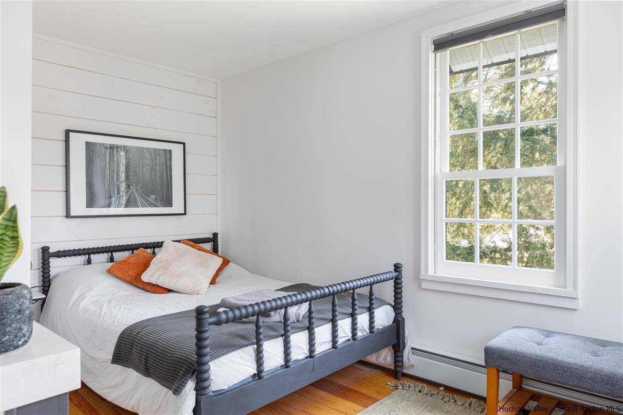 9 Clark A Road Woodbourne, NY 12788 - Photo 26 of 35 a bedroom with a bed and wooden floor