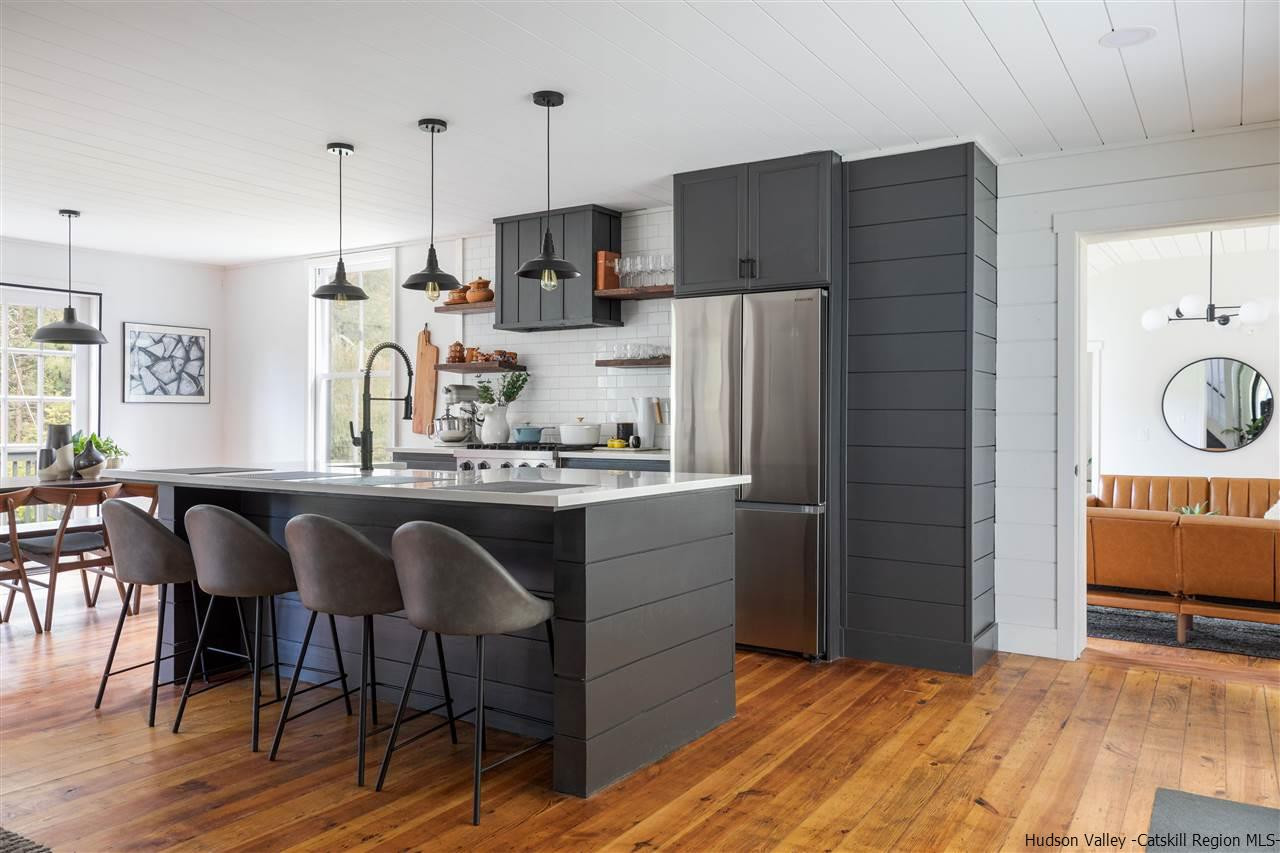 9 Clark A Road Woodbourne, NY 12788 - Photo 5 of 35 a kitchen with stainless steel appliances granite countertop a refrigerator and a stove top oven
