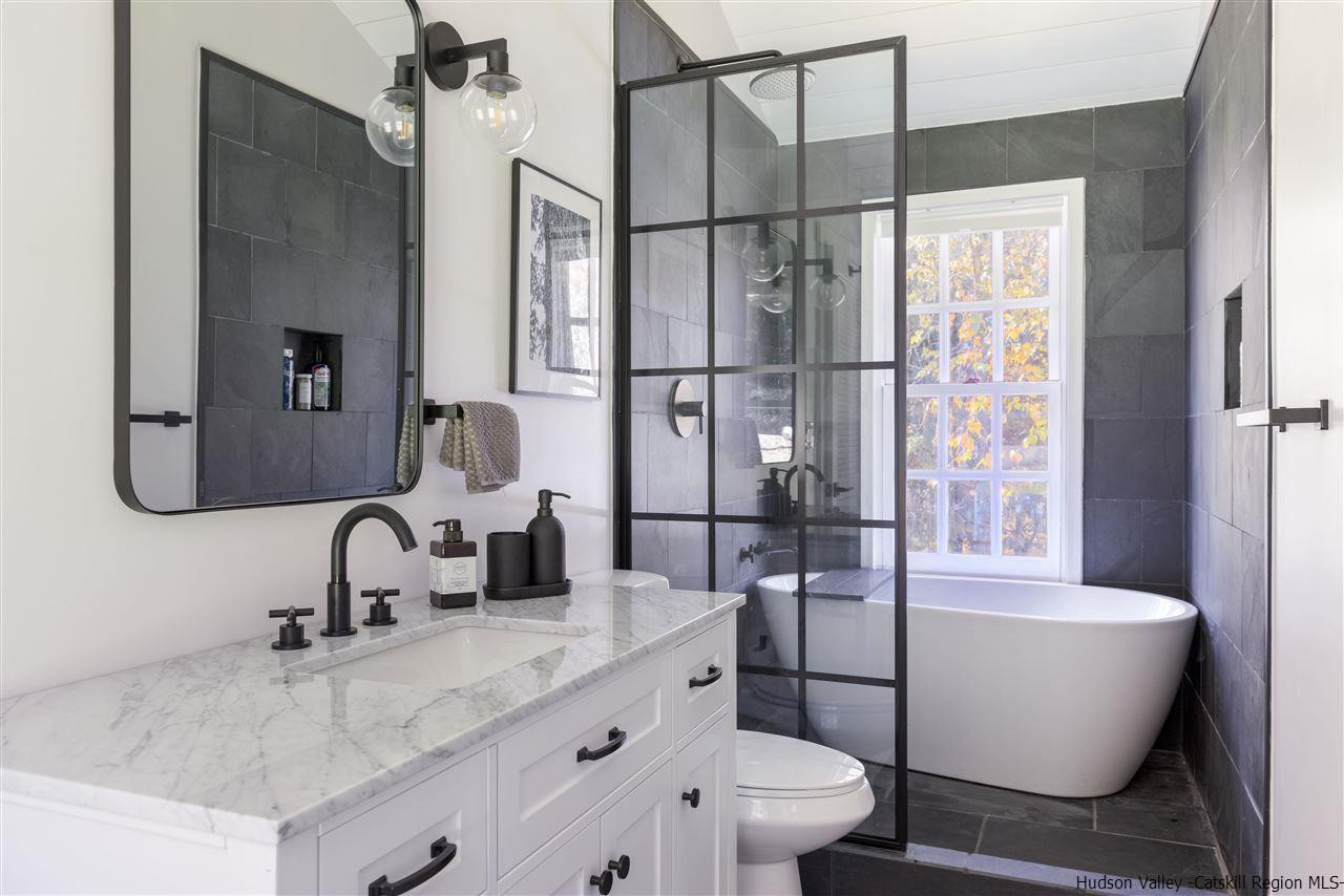 9 Clark A Road Woodbourne, NY 12788 - Photo 7 of 35 a bathroom with a granite countertop sink toilet and shower