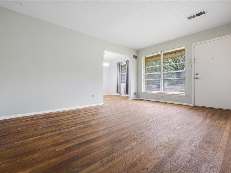 1599 Butterworth Road Memphis, TN 38116 - Photo 8 of 26 a view of empty room with wooden floor and fan