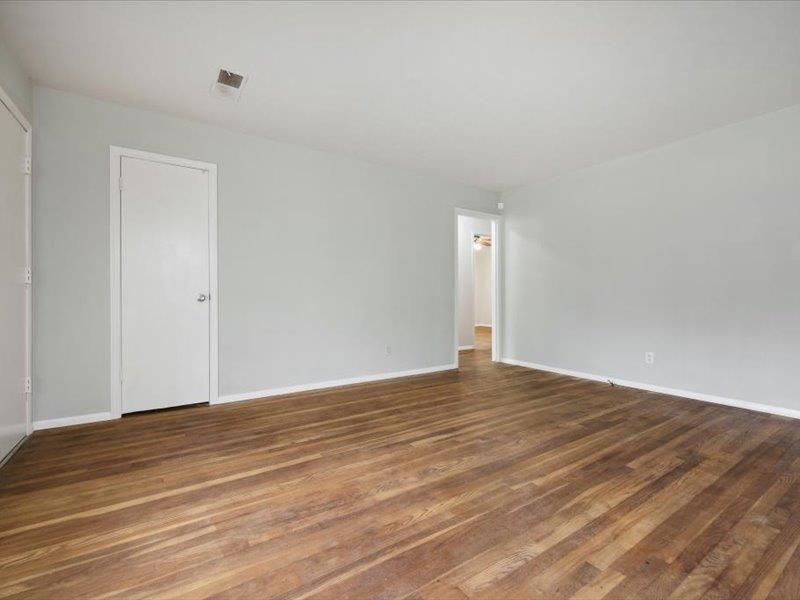 1599 Butterworth Road Memphis, TN 38116 - Photo 9 of 26 a view of an empty room with wooden floor