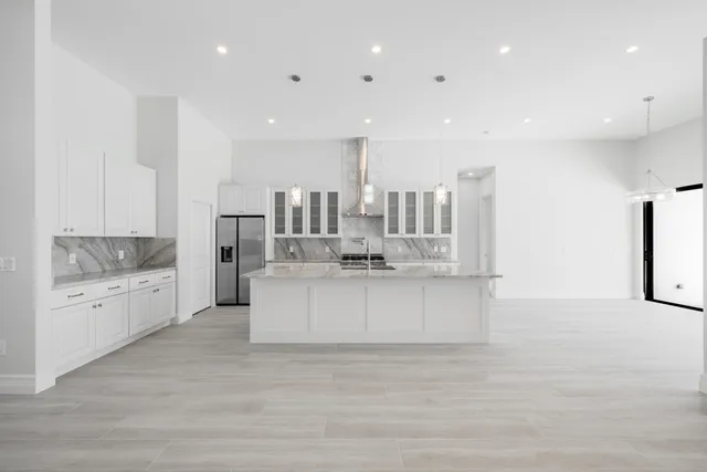 a view of a hallway with a ceiling fan