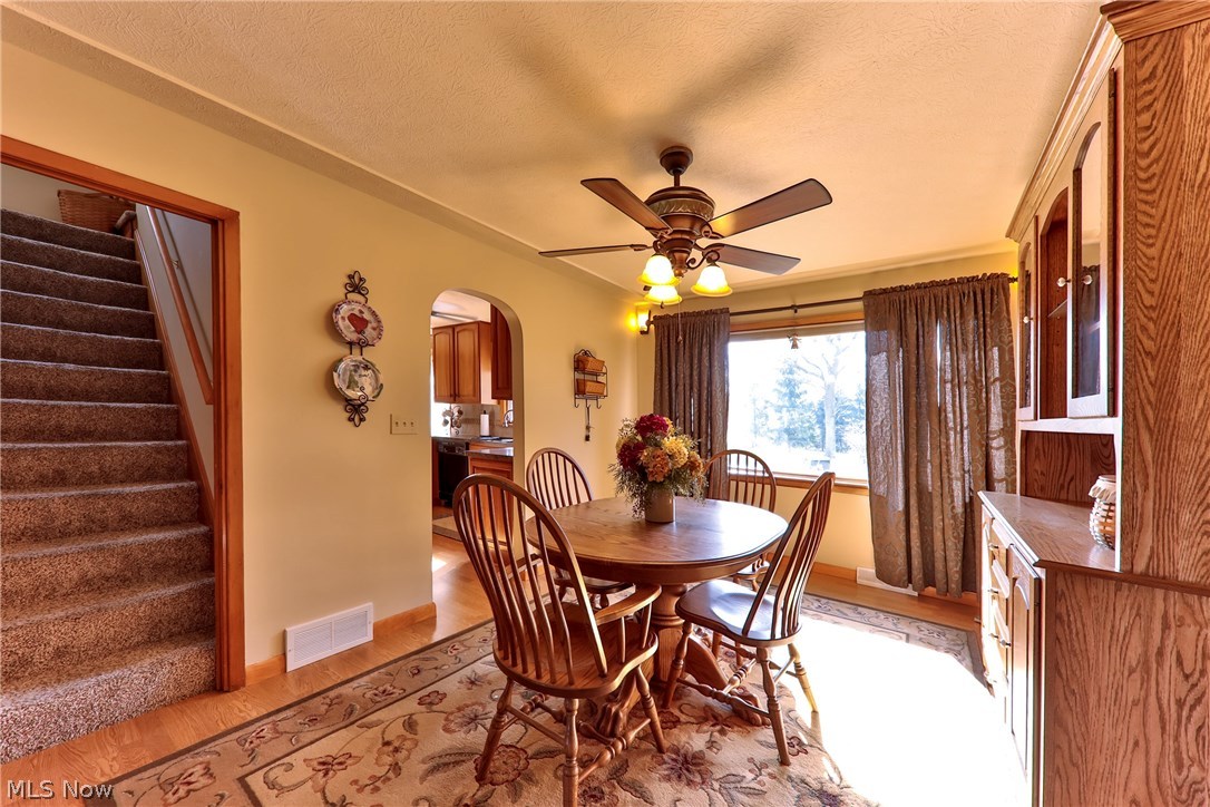1798 Center Road Avon, OH 44011 - Photo 15 of 30 Dining room with peak into kitchen & stairway to the 3rd bedroom and bonus area.