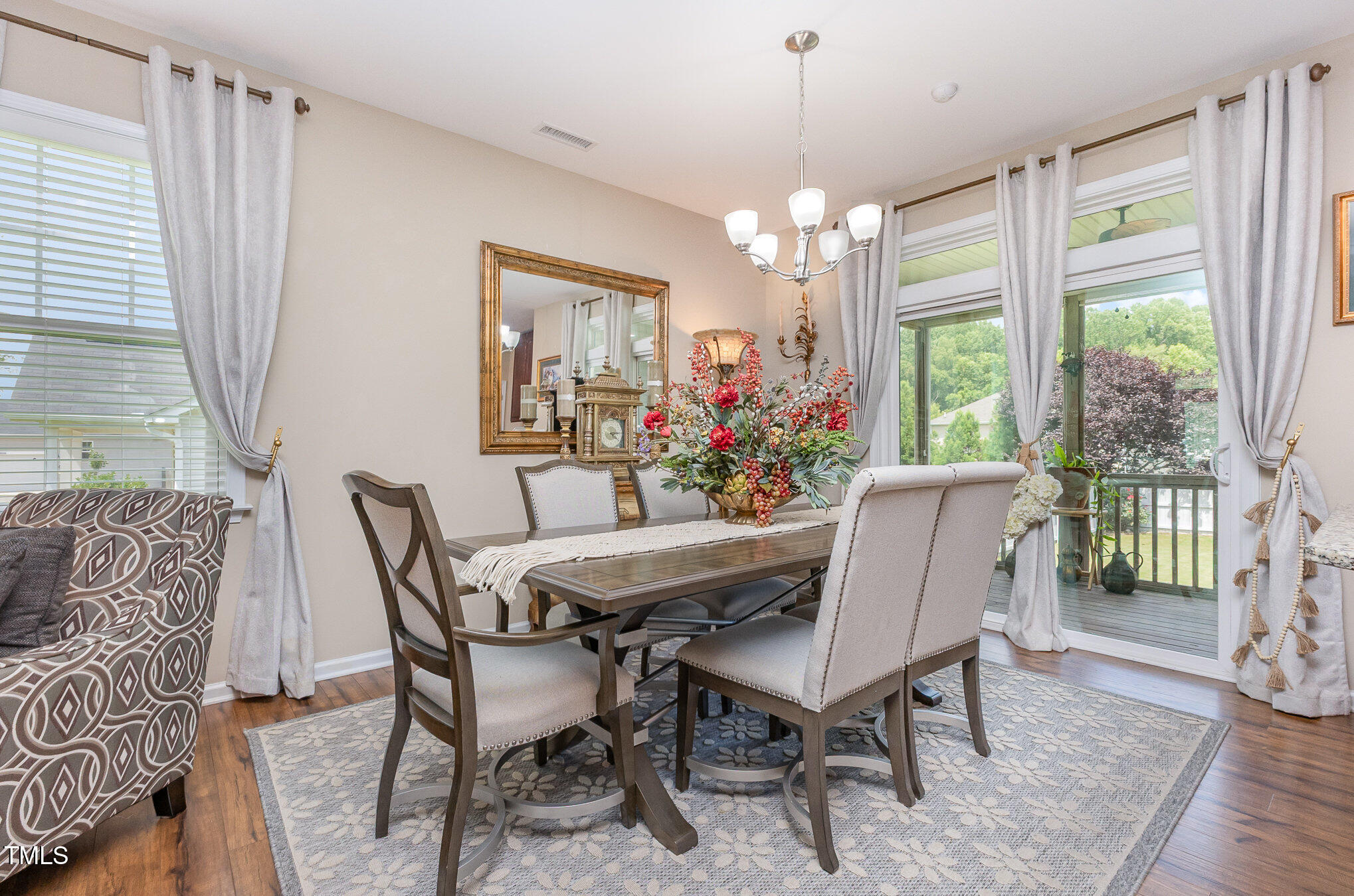 1205 Barnford Mill Road Wake Forest, NC 27587 - Photo 3 of 17 a view of a dining room with furniture window and wooden floor