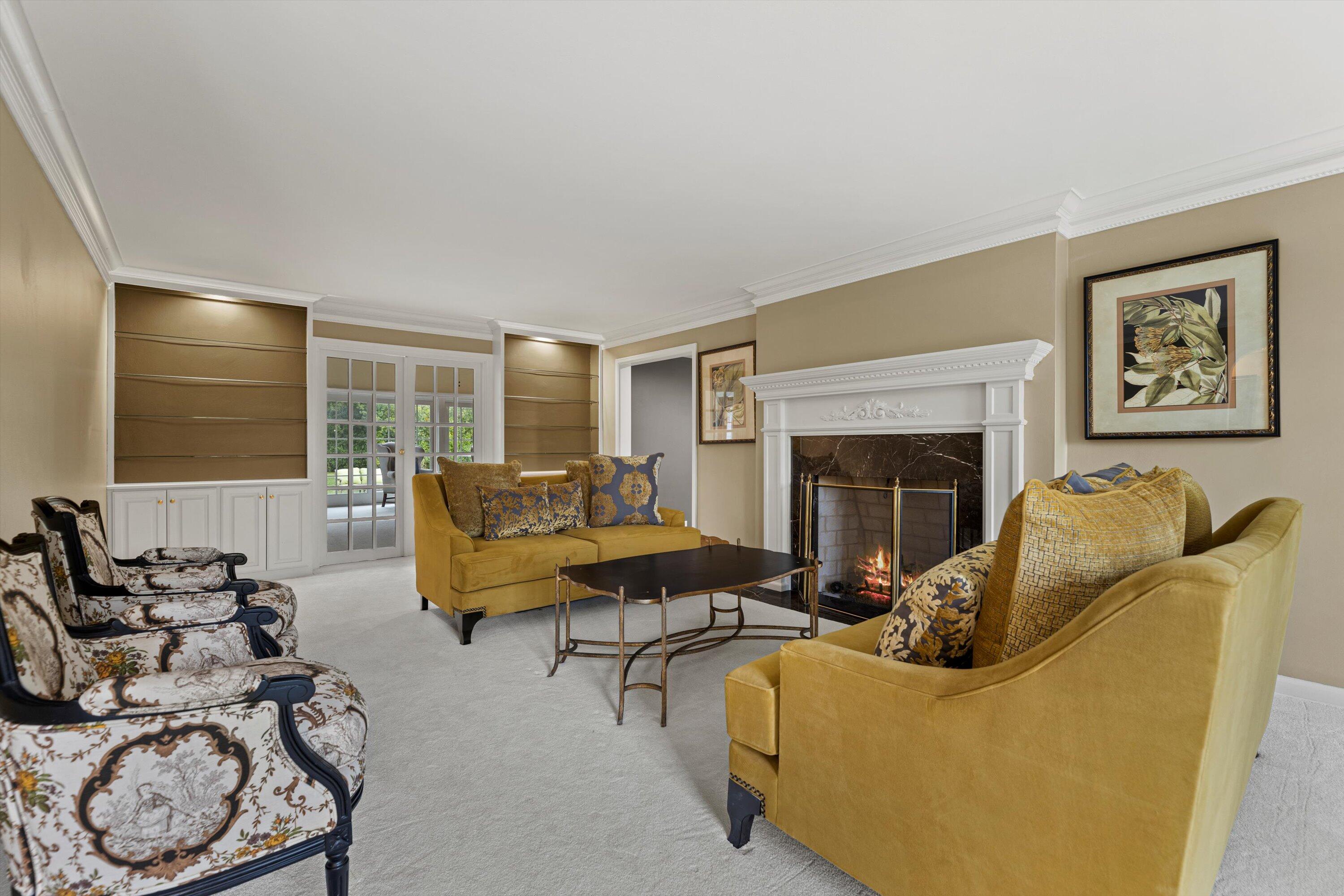 10060 North Range Line Road Mequon, WI 53092 - Photo 27 of 105 Plush carpet and a gas fireplace