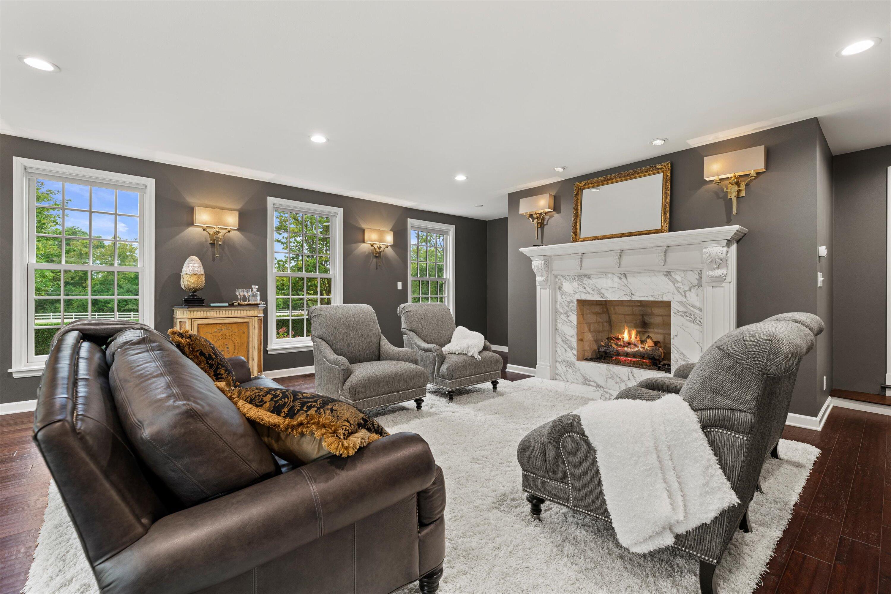 10060 North Range Line Road Mequon, WI 53092 - Photo 4 of 105 Large room full of windows. Gas fireplace