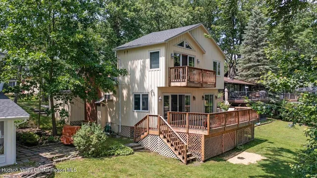 a front view of house with a garden