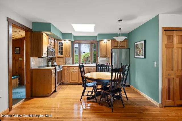 a kitchen with a stove a sink and a refrigerator