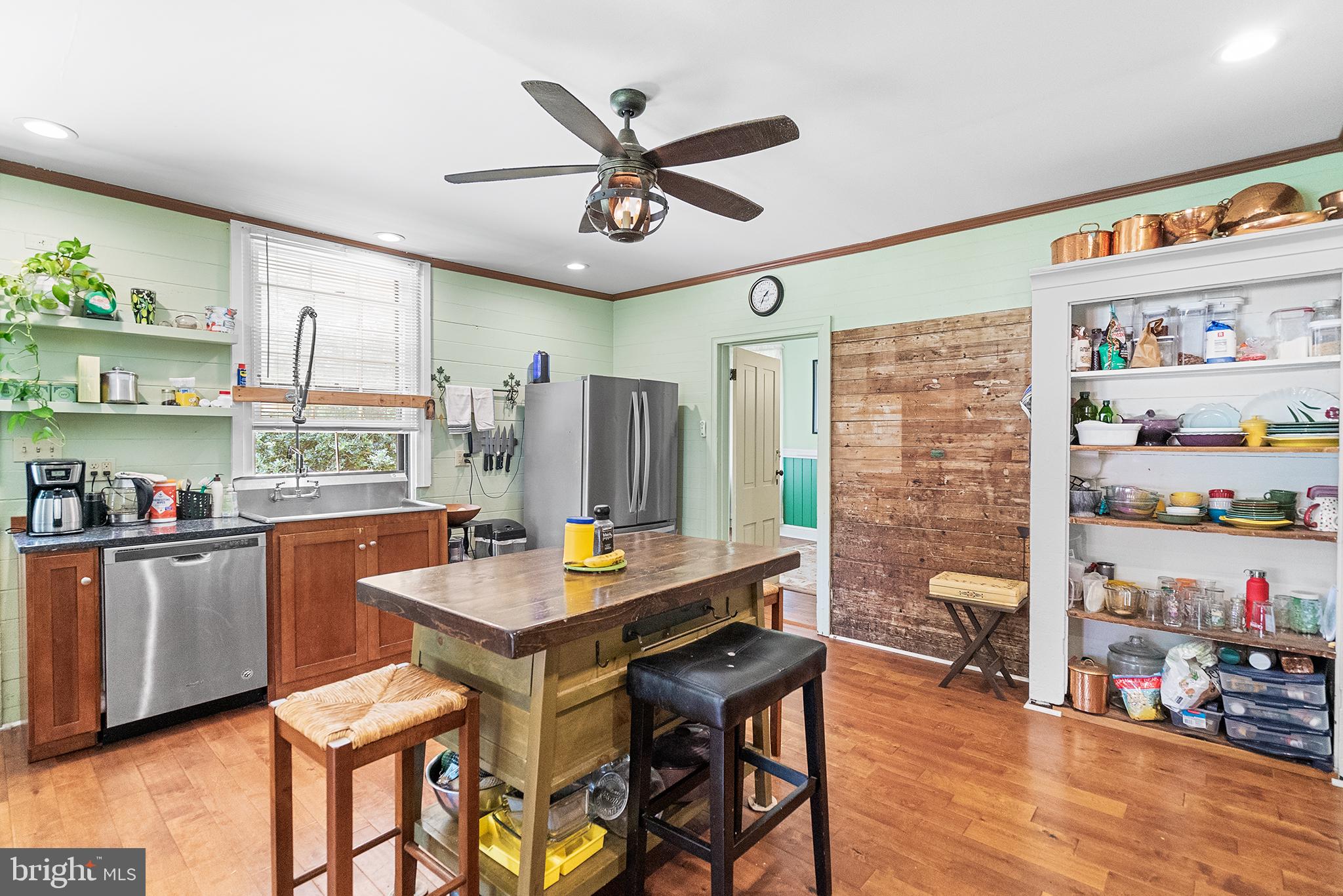 143 Barto Road Barto, PA 19504 - Photo 17 of 37 a dining room with stainless steel appliances kitchen island granite countertop a table chairs and a refrigerator