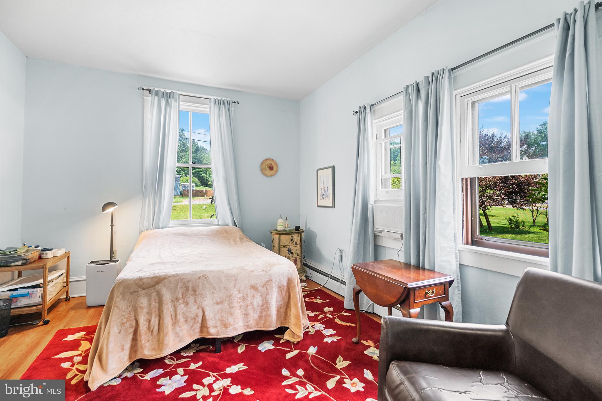 143 Barto Road Barto, PA 19504 - Photo 27 of 37 a bedroom with a bed and a couch