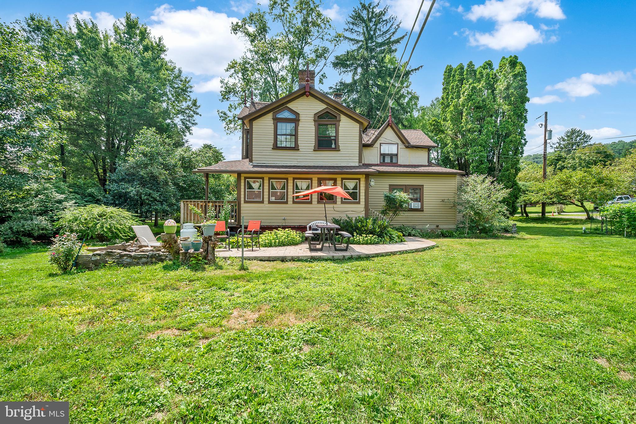143 Barto Road Barto, PA 19504 - Photo 5 of 37 a front view of a house with garden and trees