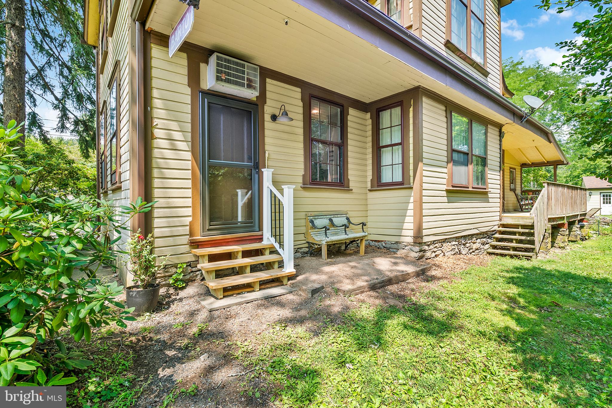 143 Barto Road Barto, PA 19504 - Photo 8 of 37 a view of a house with a large window and wooden fence