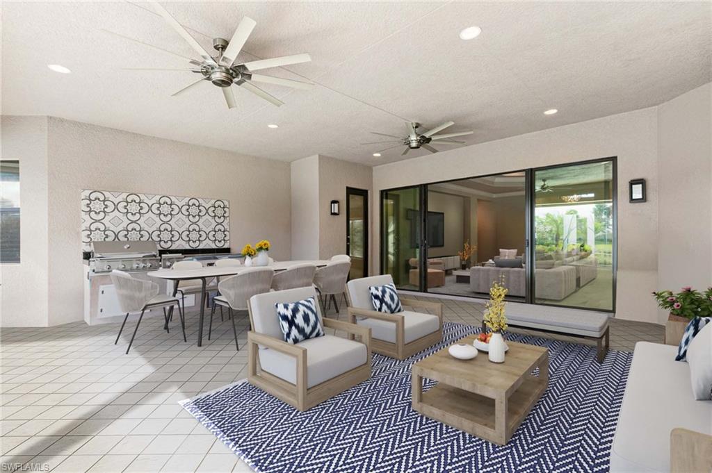 4366 Caldera Circle Naples, FL 34119 - Photo 18 of 41 a living room with furniture a rug potted plant and a large window
