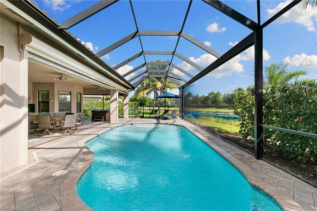 4366 Caldera Circle Naples, FL 34119 - Photo 19 of 41 a view of swimming pool with seating area