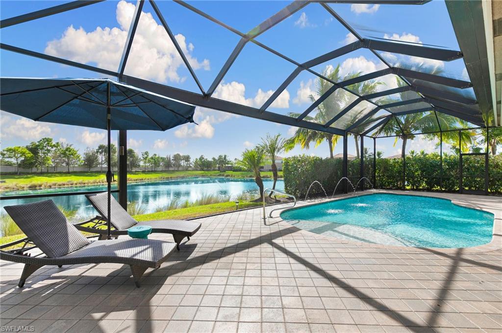 4366 Caldera Circle Naples, FL 34119 - Photo 2 of 41 a view of swimming pool with a patio