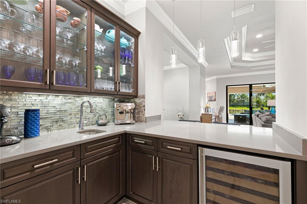 4366 Caldera Circle Naples, FL 34119 - Photo 28 of 41 a kitchen with a sink and large window