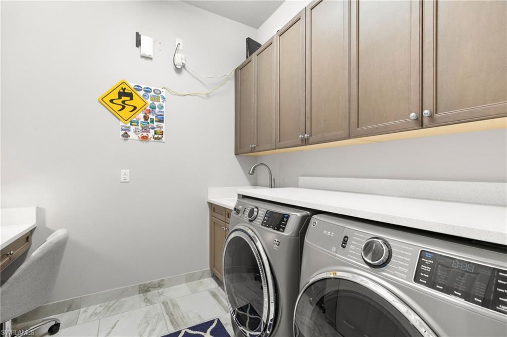 4366 Caldera Circle Naples, FL 34119 - Photo 30 of 41 a utility room with dryer and washer