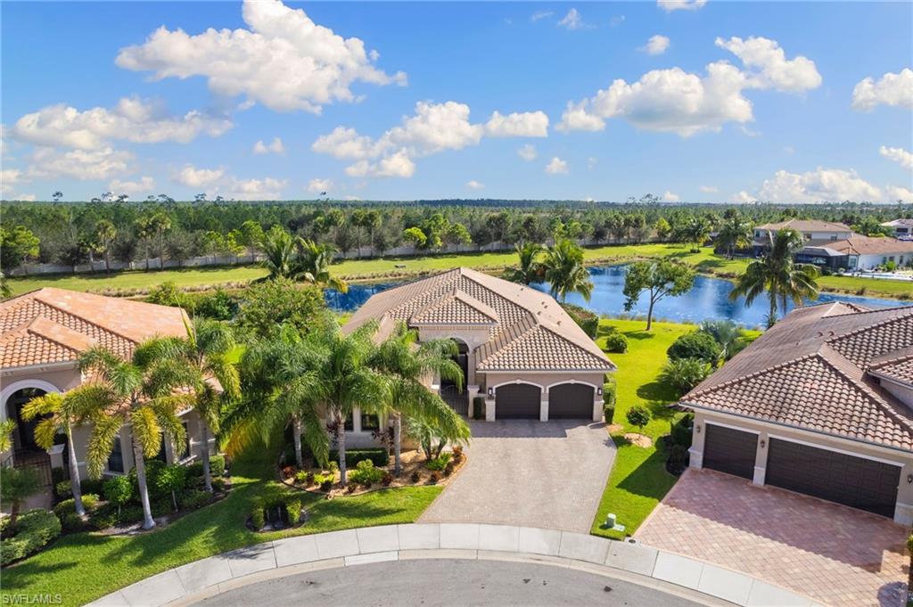 4366 Caldera Circle Naples, FL 34119 - Photo 33 of 41 a view of a garden with houses