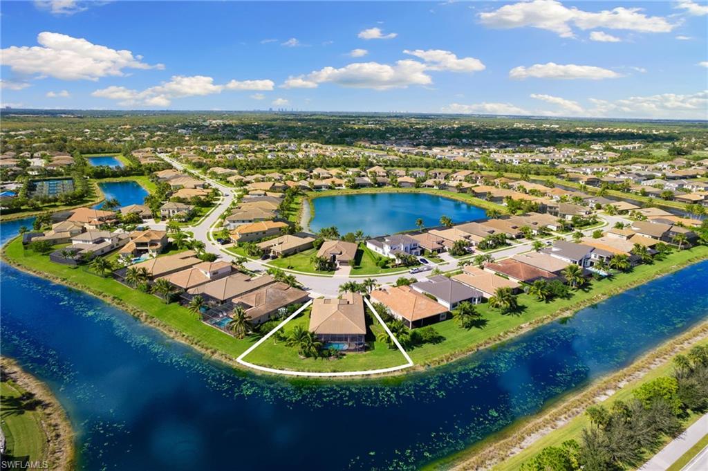 4366 Caldera Circle Naples, FL 34119 - Photo 35 of 41 a view of a swimming pool with a lake view