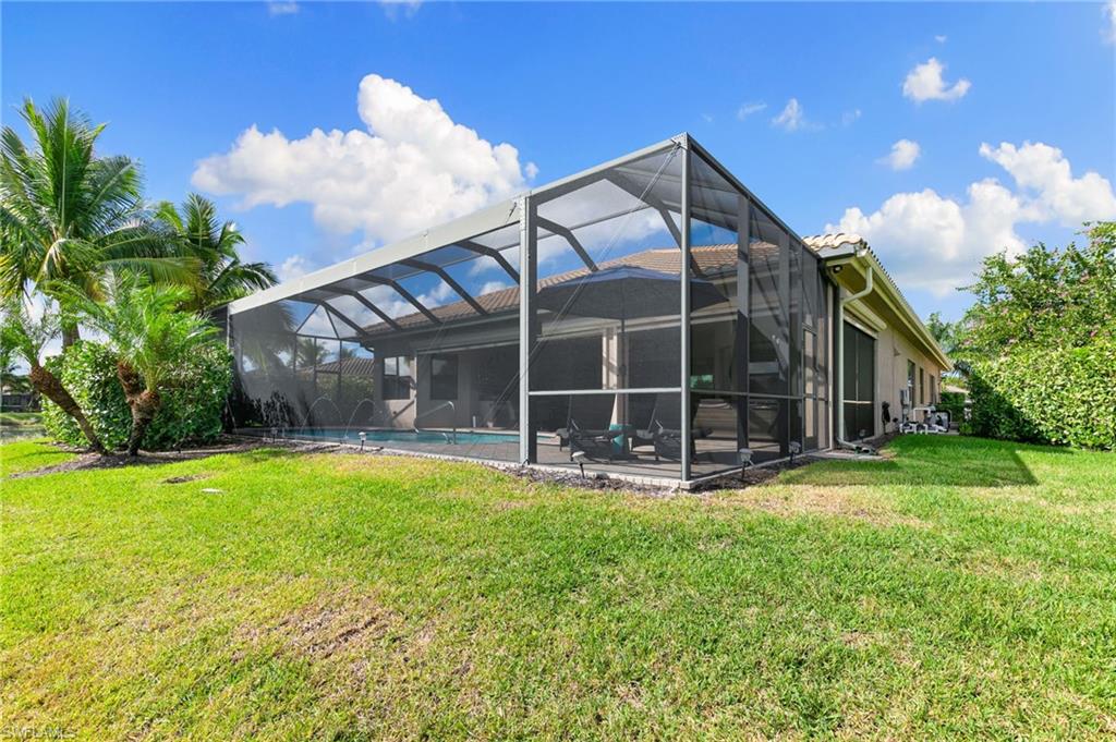 4366 Caldera Circle Naples, FL 34119 - Photo 39 of 41 a view of a house with backyard and sitting area