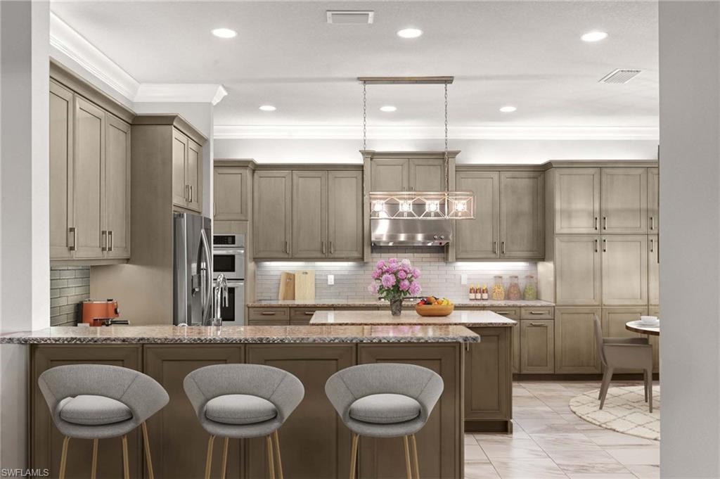 4366 Caldera Circle Naples, FL 34119 - Photo 4 of 41 a kitchen with a dining table chairs sink and cabinets