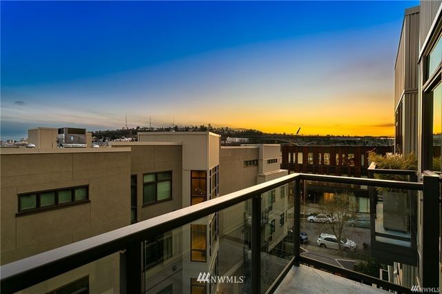 a view of a balcony with city view