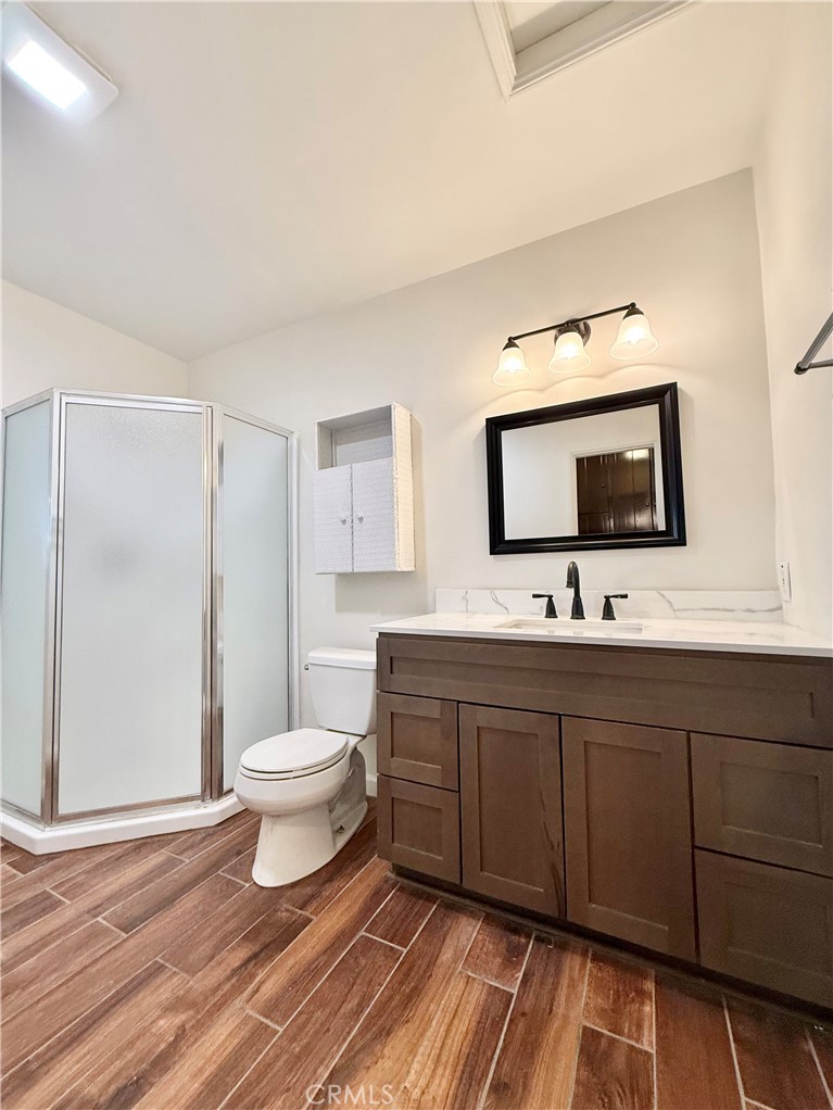 24 10th Court Hermosa Beach, CA 90254 - Photo 6 of 31 a bathroom with a toilet a sink and mirror